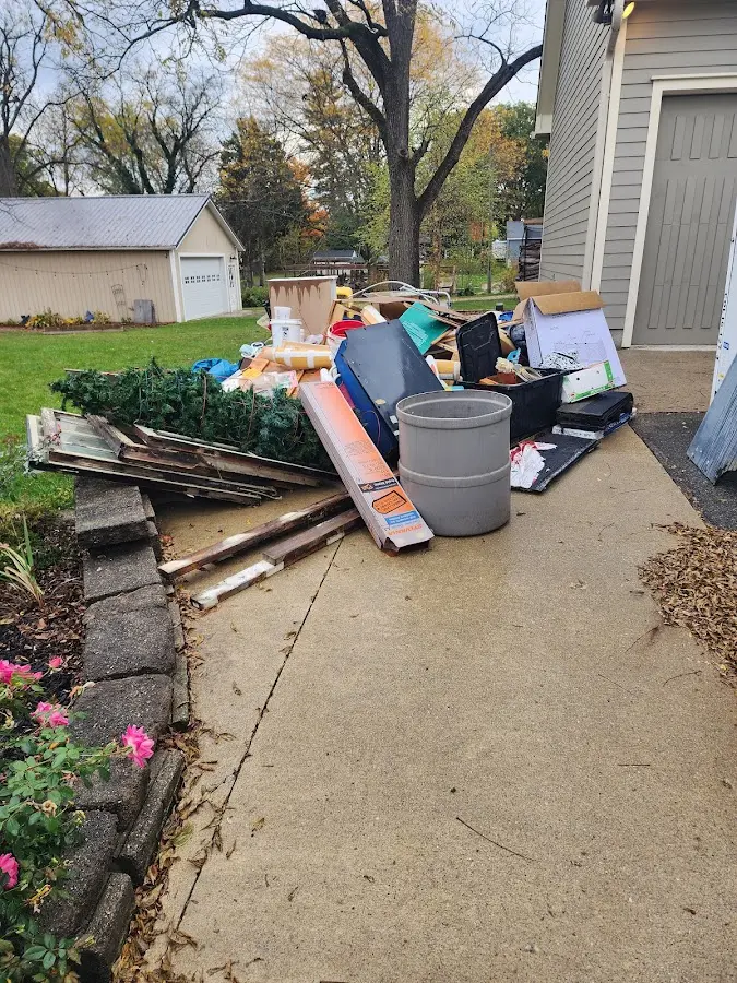 Dumpster being loaded with debris for 3 Yard Dumpster Rental in Mead Valley